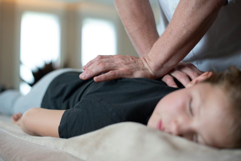 a woman getting a back massage from a man